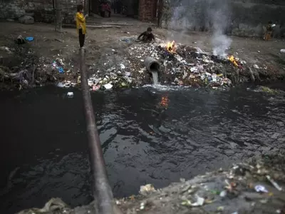dumping waste in drain