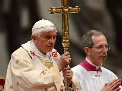 Pope holds Easter candle at basilica vigil
