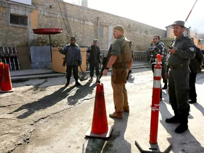 Afghan Policewoman Kills US Adviser