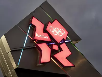 London Olympic watchdog member quits over Dow deal