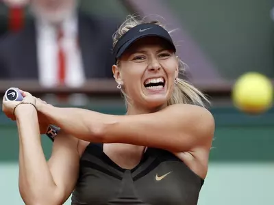 Sharapova outshines Williams sisters in style