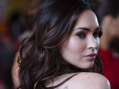 Megan Fox shows off growing belly