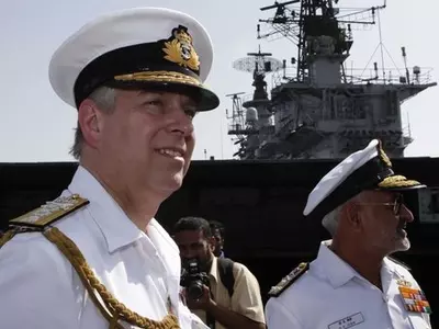Prince Andrew, the Duke of York (L) with D.K Joshi (R)