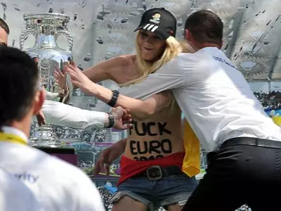 Topless protest at Euro 2012 trophy display
