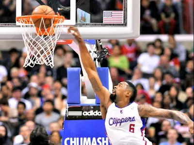Los Angeles Clippers center DeAndre Jordan (6) throws down a dunk in front of Phoenix Suns forward Luis Scola (14), of Argentina, and forward Wesley Johnson (2)