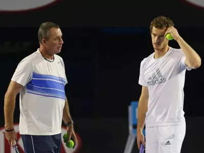 Andy Murray of Great Britain serves as his coach Ivan Lendl looks on in training session. (Getty Images)