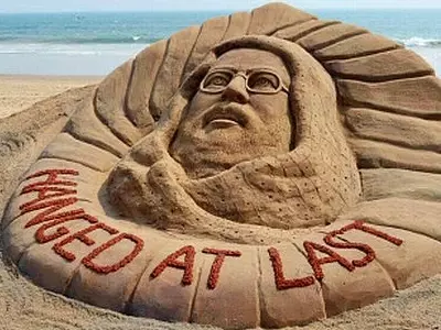 t a sand sculpture of Kashmiri Mohammed Afzal Guru who was executed Saturday morning, at a beach in Puri