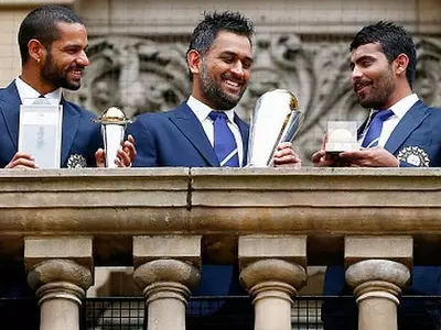 India's Dhawan, Dhoni and Jadeja pose with the ICC Champions Trophy