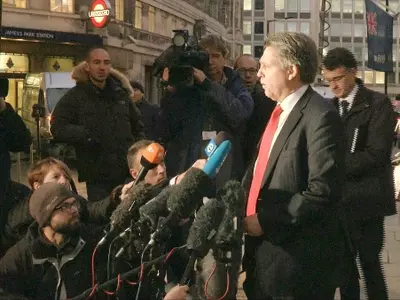 Kevin Hyland, head of the Metropolitan Police's human trafficking unit speaks to the media outside New Scotland Yard's headquarters in London