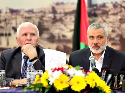 Fatah official Azzam al-Ahmad, Hamas Prime Minister Ismail Haniyeh