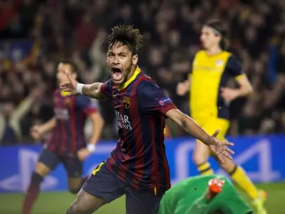 Barcelona's Neymar celebrates after scoring a goal against Atletico Madrid during their Champions League quarterfinal match at Camp Nou stadium in Barcelona.