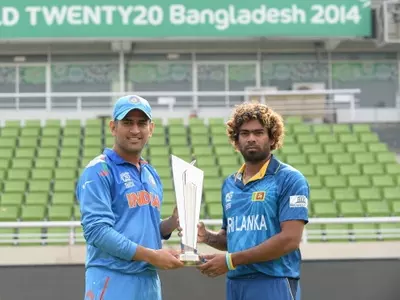 Indian skipper MS Dhoni and Sri Lankan captain Lasith Malinga hold the coveted ICC World Twenty20 trophy.