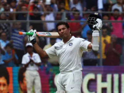 Sachin Tendulkar acknowledges the crowd after his final innings for India.