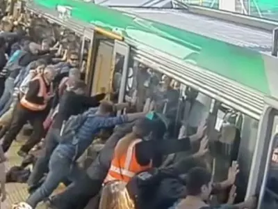 People Push Train to Help Trapped Man