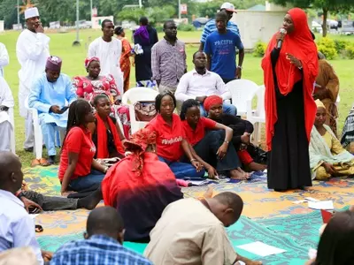 A member of Abuja's 'Bring Back Our Girls' protest group speaks in a meeting at the Unity Fountain in Abuja