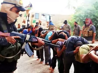 ISIS Jihadists Crucify 9 Men