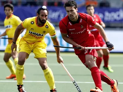 Belgium's Simon Gougnard (right) fights for the ball with India's Sardar Singh during the Hockey World Cup 2014 group stage match at The Hague, Netherlands.