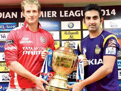 Kings XI Punjab skipper George Bailey (left)and Kolkata Knight Riders captain Gautam Gambhir with the IPL trophy.