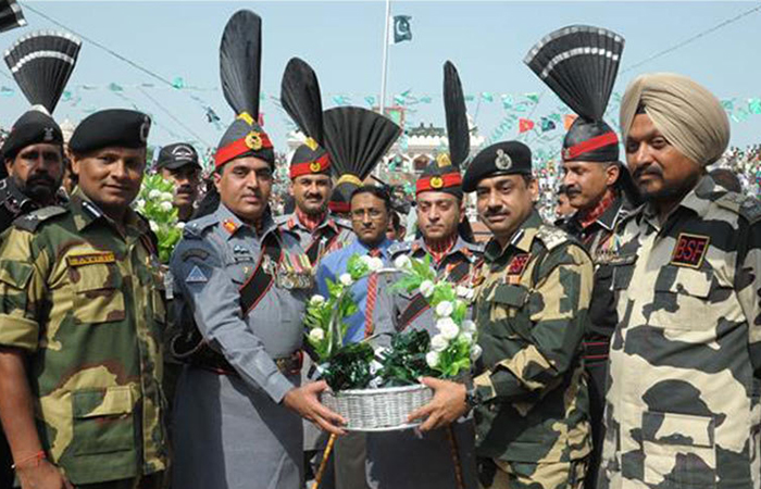 Image result for Indian, Pakistan security forces exchange sweets on LoC, IB