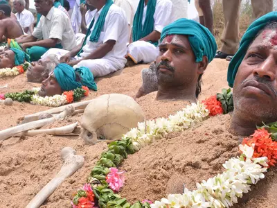 Farmers Bury Themselves In Sand