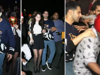 Varun Dhawan Escapes On Scooter After A See Of Fans Mob Him And Nora Fatehi Outside A Church