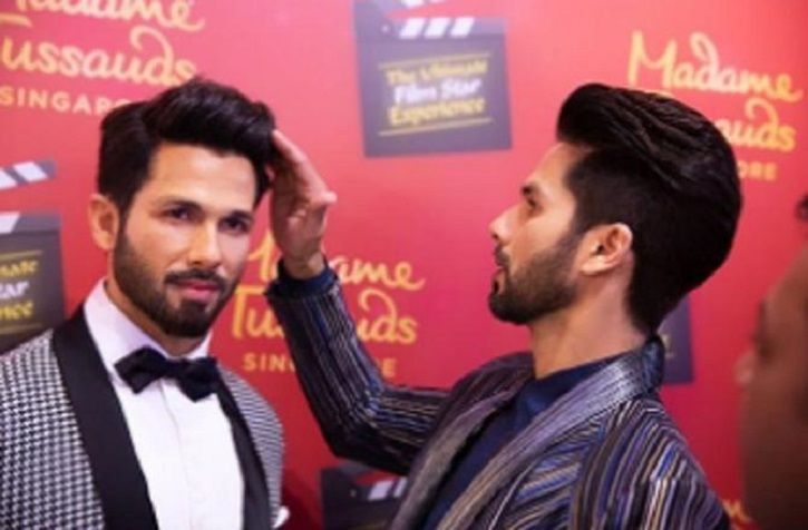 Image result for Shahid Kapoor unveils his wax statue at Madame Tussauds and fans cannot decide who is better looking