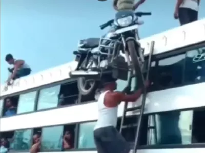 man balancing bike on head