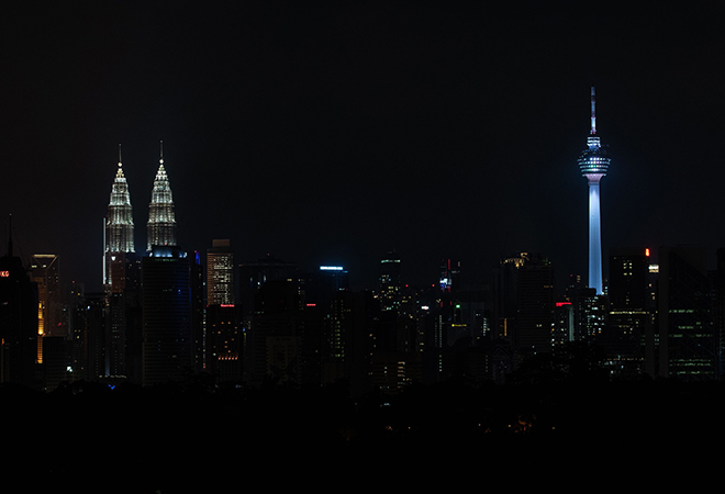 The Petronas Twin Towers and Kuala Lumpur Tower in Malaysia in Earth Hour 2020