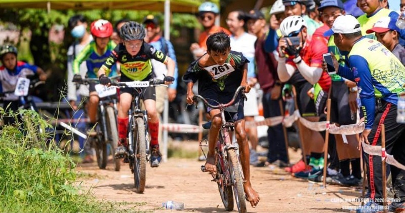 Cambodian Boy Takes Part In Cycling Event With Old Cycle No Shoes