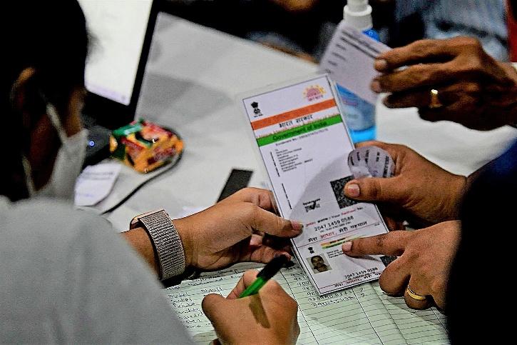 Explained: bill to link Aadhar and voter ID