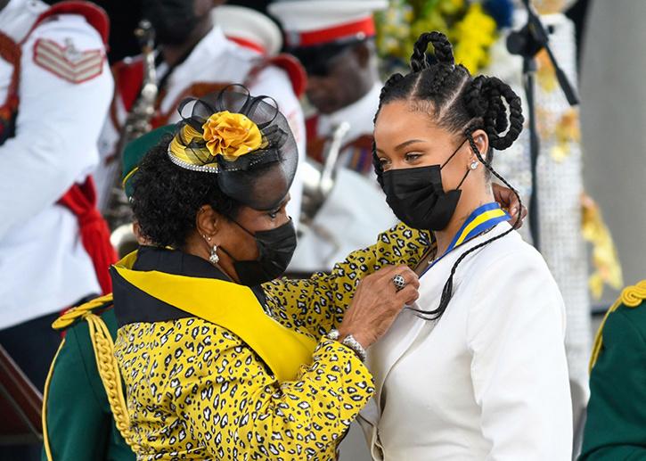 Rihanna Fenty (R) being conferred with the honour of Barbados 11th National Hero by President Dame Sandra Mason