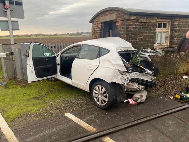 Train crashes into car at level crossing
