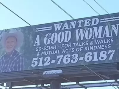 single man puts billboard on highway for a good woman