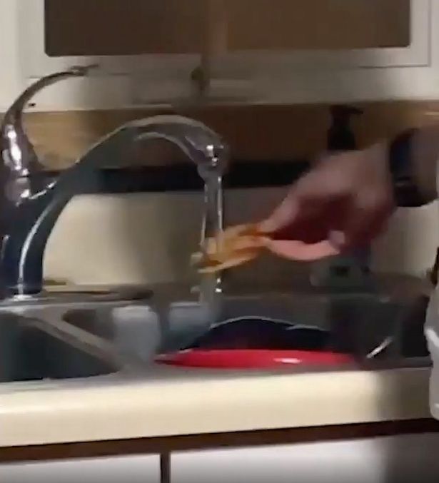 man wetting pizza