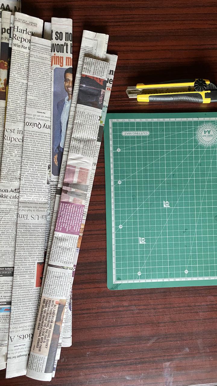 Making A Basket With Old Newspapers