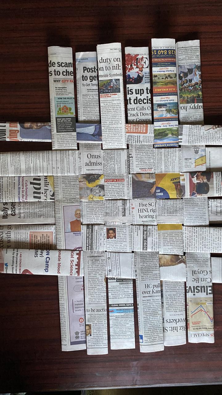 Making A Basket With Old Newspapers