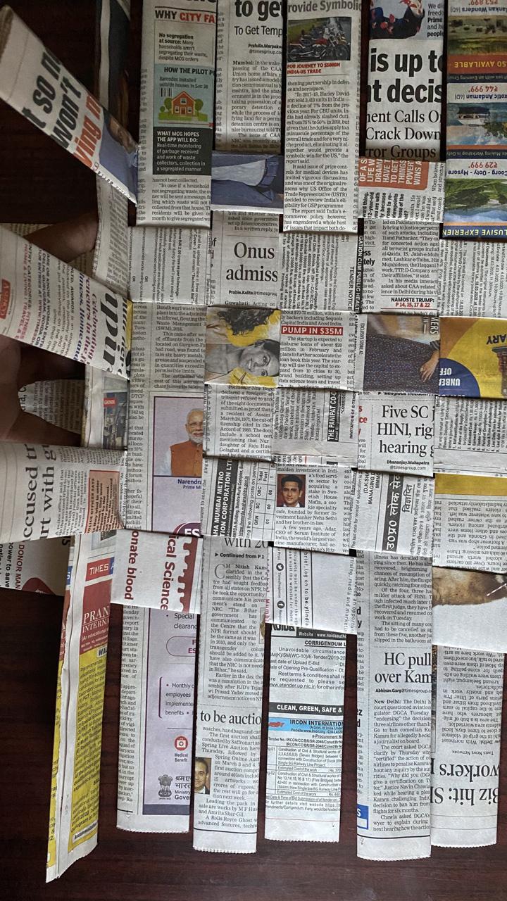 Making A Basket With Old Newspapers