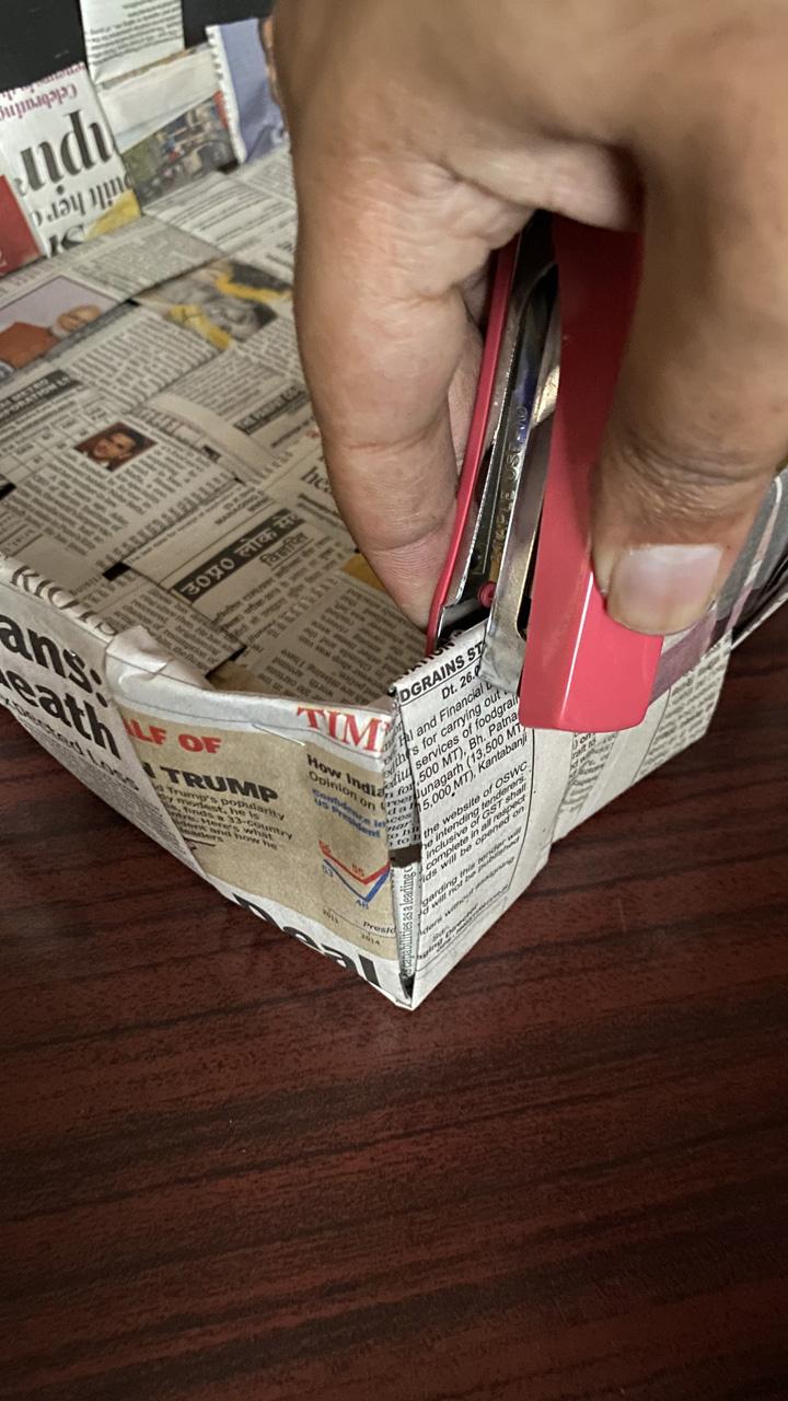 Making A Basket With Old Newspapers
