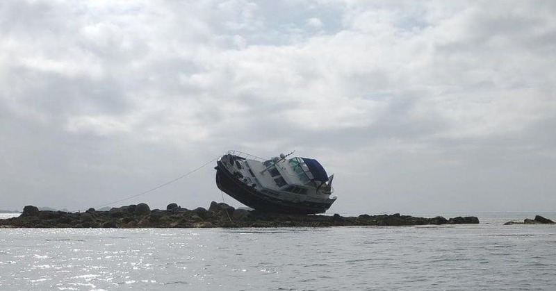 Boat Is Left Perched On Rocks After Running Aground