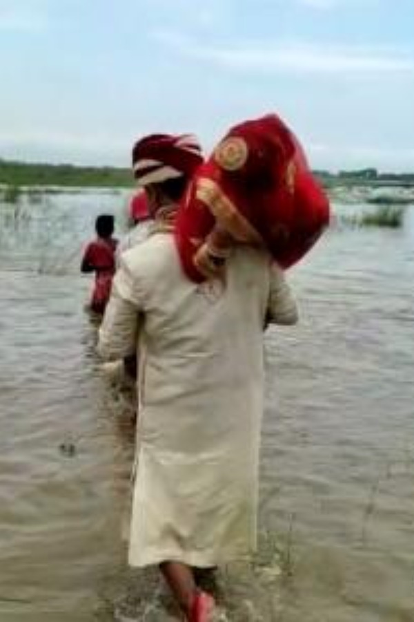 Watch: People Cheer On As Groom Lifts Up Bride On Shoulder To Cross The River After Boat Gets Stuck In Sand