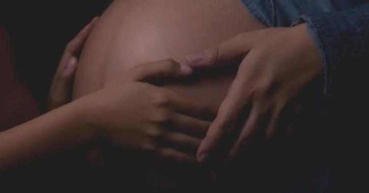 Pregnant woman A woman was shocked when she found out that she was pregnant despite being a virgin. She has a medical condition called vaginismus.