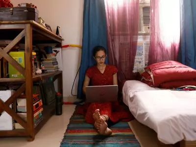 A girl using her laptop to work from home