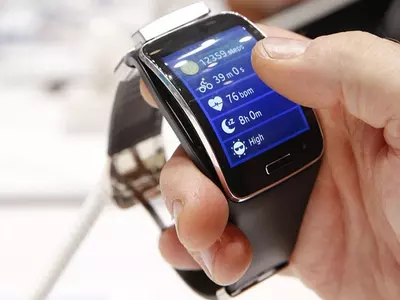 Man using smartwatch features
