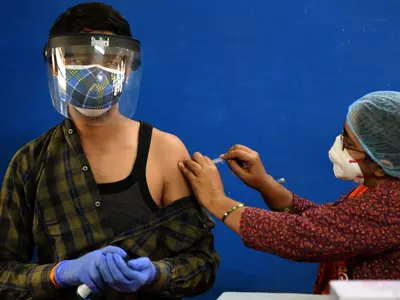 Man receiving Covid-19 vaccine