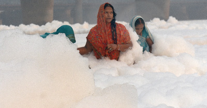 People Take Dip In Yamuna In The Midst Of Toxic Foam