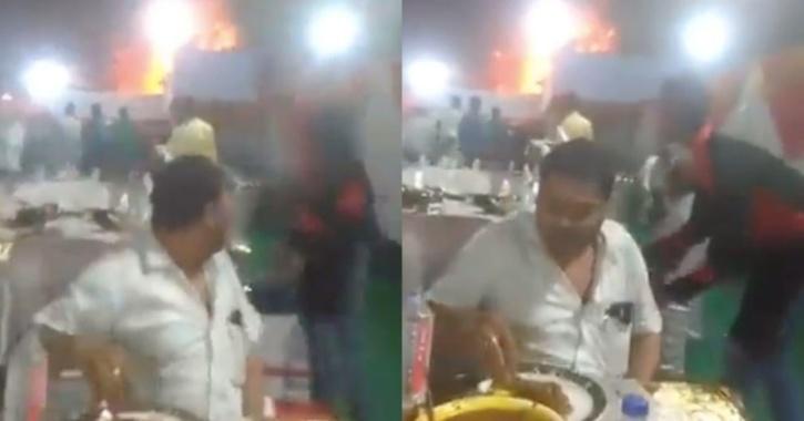guy eats food during fire