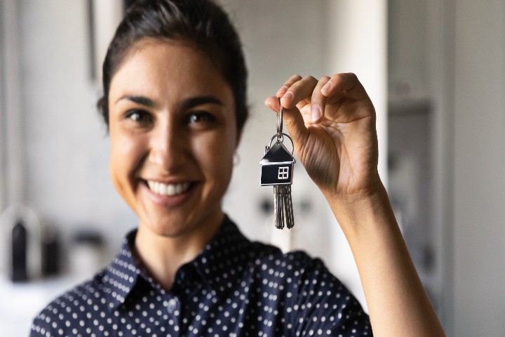 happy woman with house key