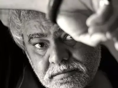 A black and white photo of Sanjay Mishra.