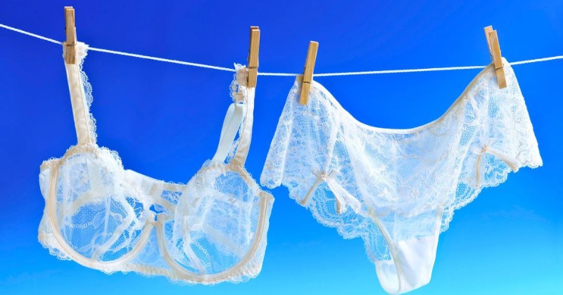 Shop of womens underwear. Womens panties on hangers in a sex store