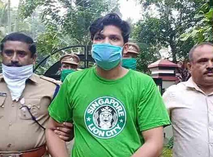 Sooraj being arrested by the Kerala police for murdering his wife via a snake.